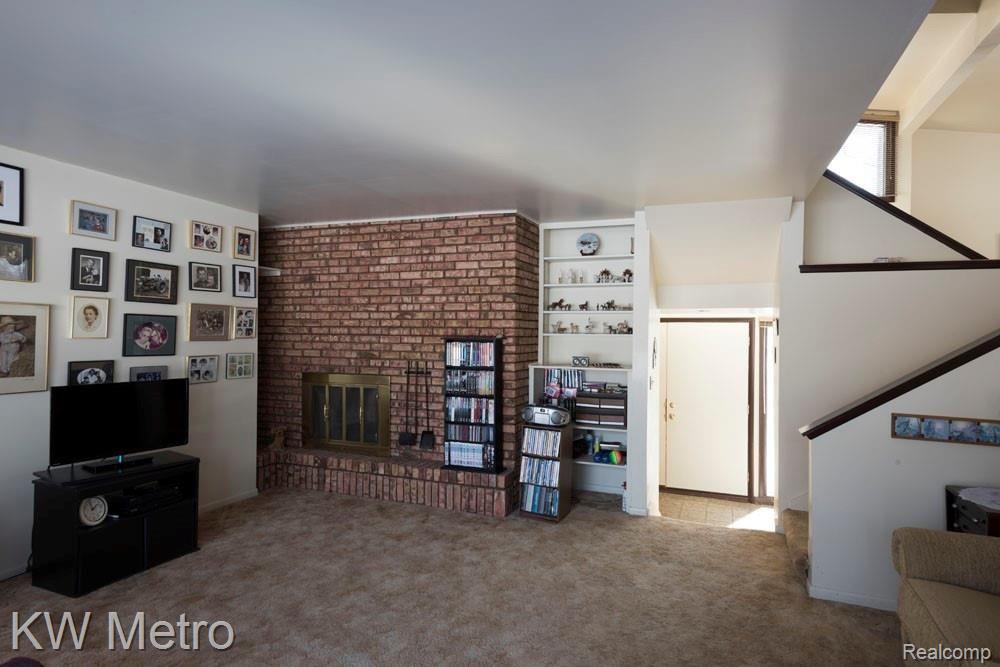 9220 Kier Road Holly, MI 48442 - Photo 22 of 35 Living Room, natural fire place