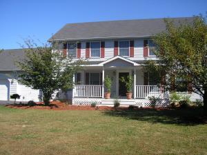108 Hamilton Road East Stroudsburg, PA 18360 - Photo 1 of 1 a front view of a house with a yard table and chairs