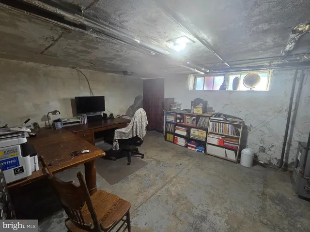 a view of a workspace with furniture