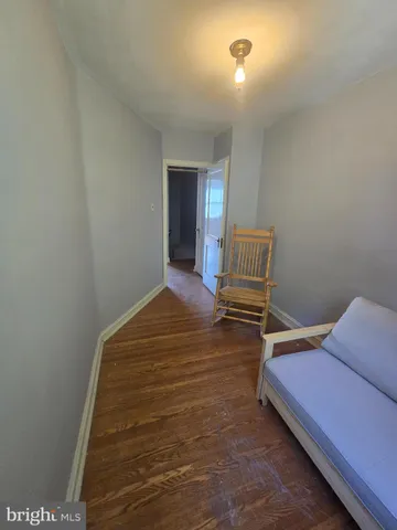 a bedroom with a bed and dresser