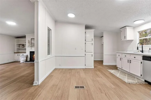 a view of a kitchen with wooden floor