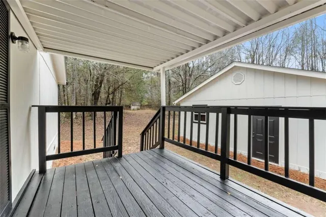 a view of wooden balcony with wooden floor