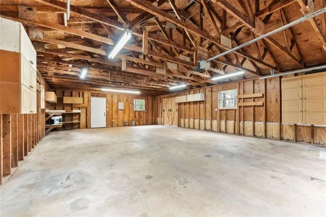 a view of a room with wooden walls
