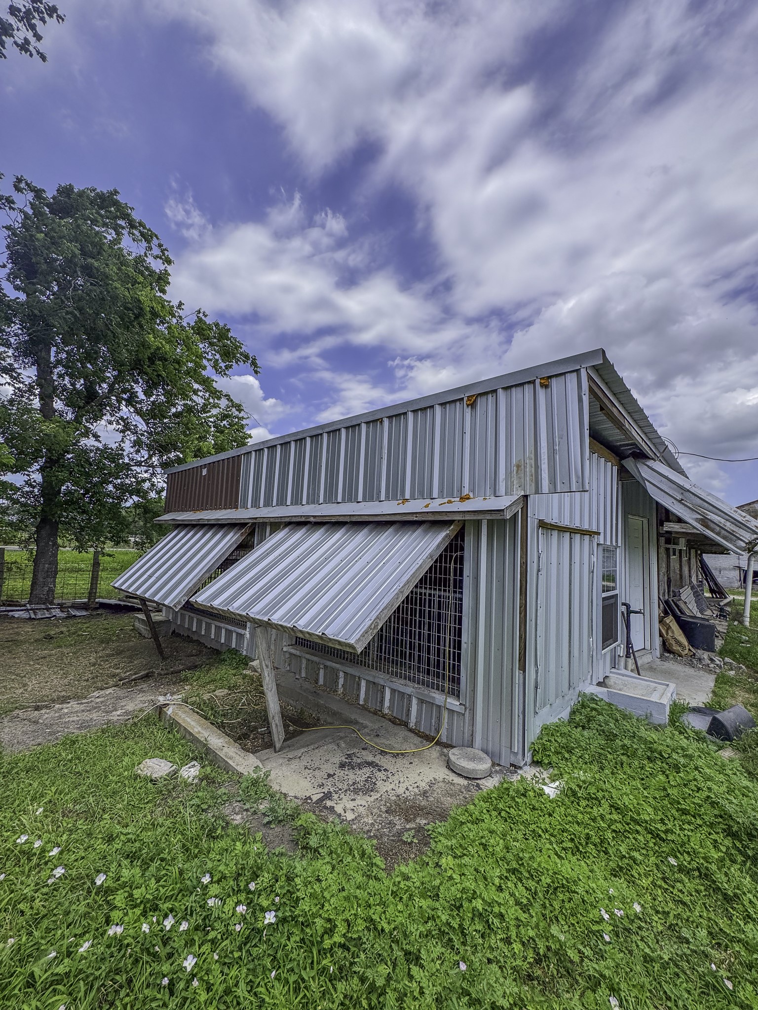 11810 Zamanek Road Needville, TX 77461 - Photo 23 of 30 a backyard of a house with table and chairs
