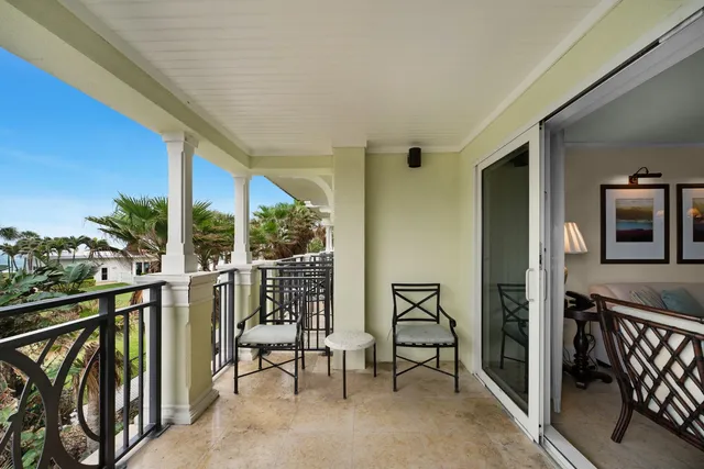 a view of two chairs in the balcony