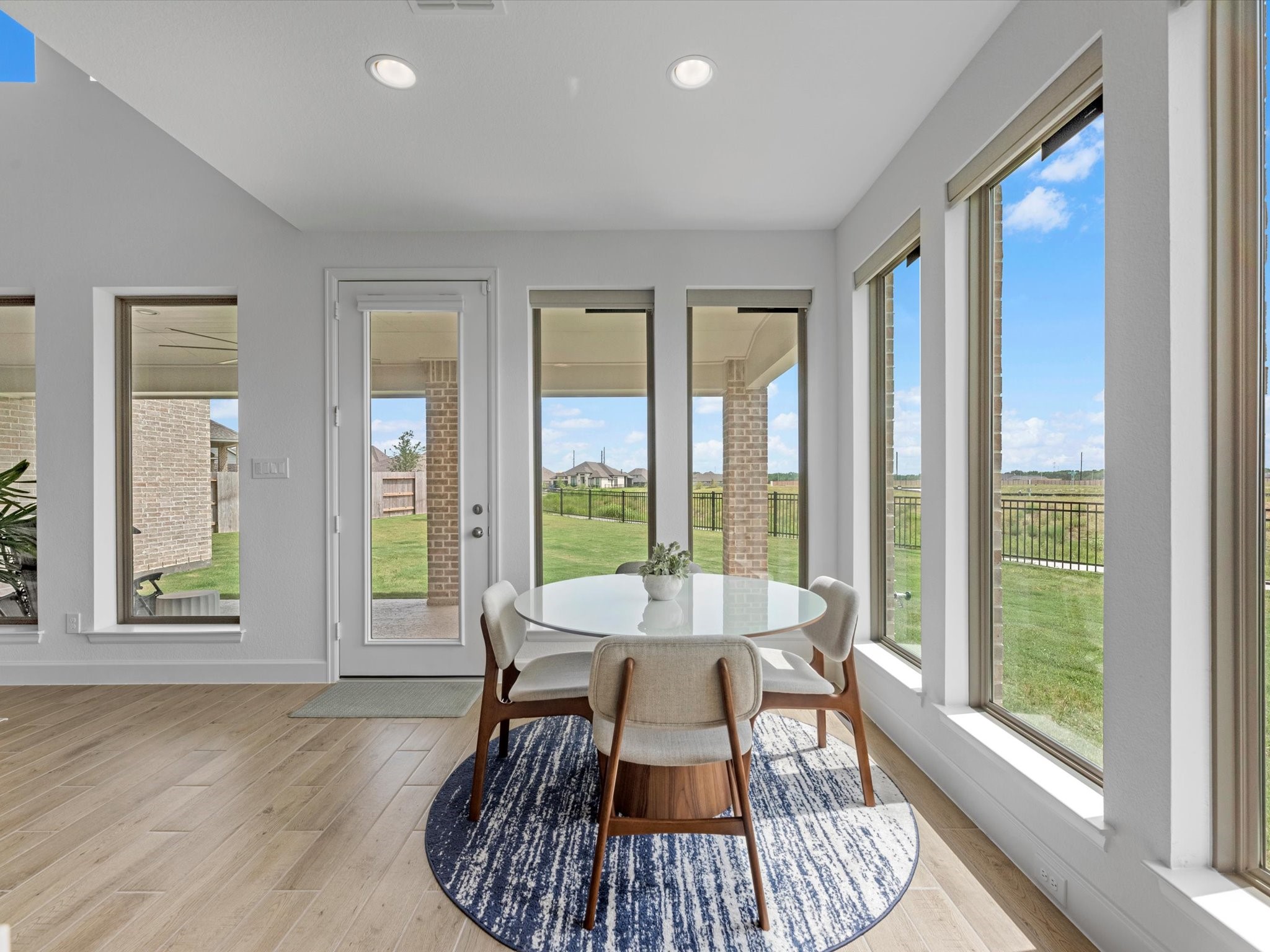 18714 Pistachio Way Manvel, TX 77578 - Photo 14 of 48 Enjoy casual dining in the light-filled breakfast area, where expansive windows overlook the covered patio and oversized backyard.