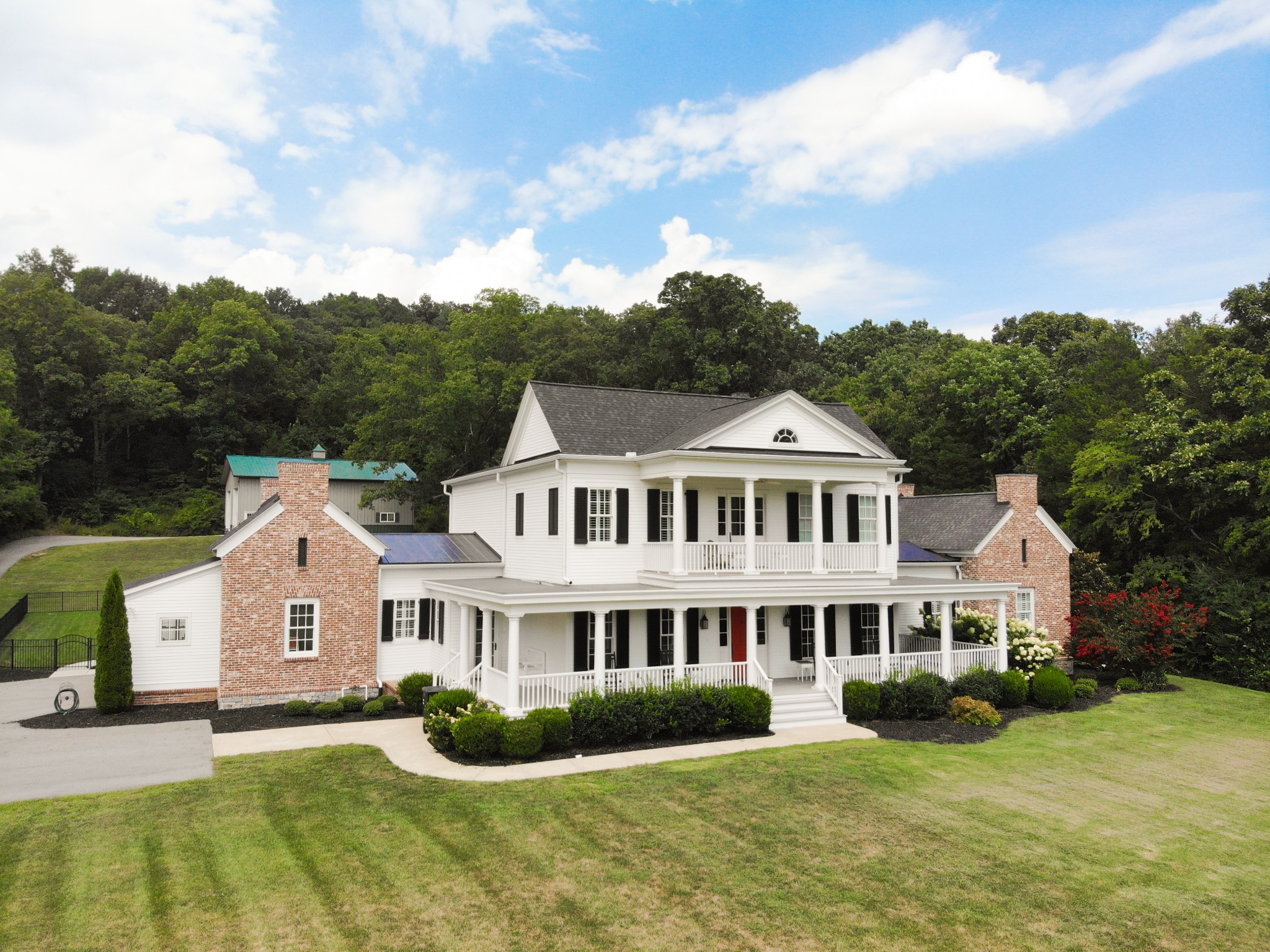 3290 Carl Road Franklin, TN 37064 - Photo 2 of 49 a front view of a house with a garden and plants