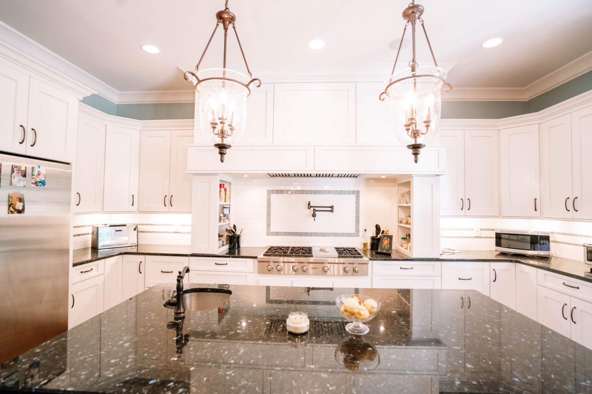 3290 Carl Road Franklin, TN 37064 - Photo 12 of 49 a kitchen with a sink dishwasher a stove and white cabinets with wooden floor