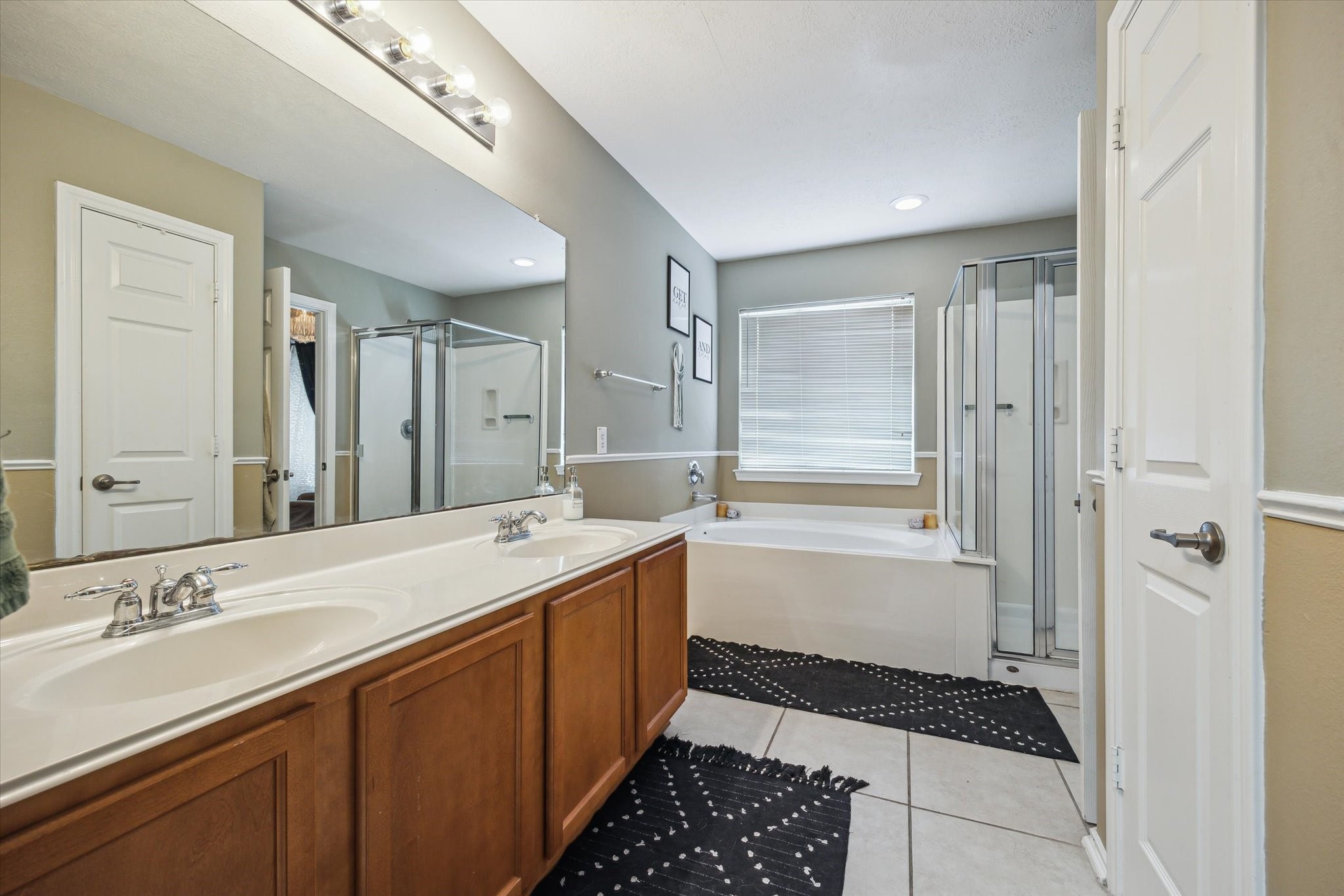 225 Drake Run Lane Dickinson, TX 77539 - Photo 12 of 22 a bathroom with a sink a toilet a shower and a mirror