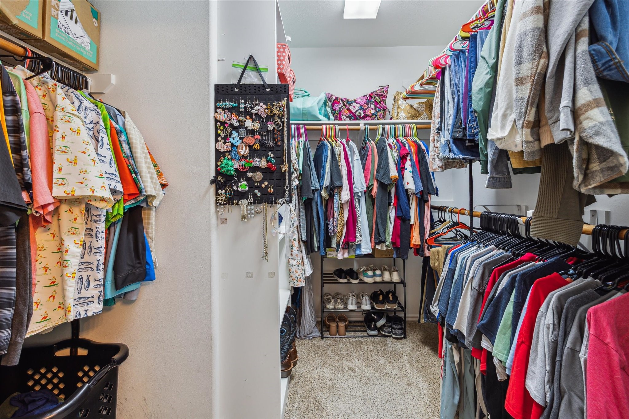 225 Drake Run Lane Dickinson, TX 77539 - Photo 14 of 22 a view of walk in closet with clothes