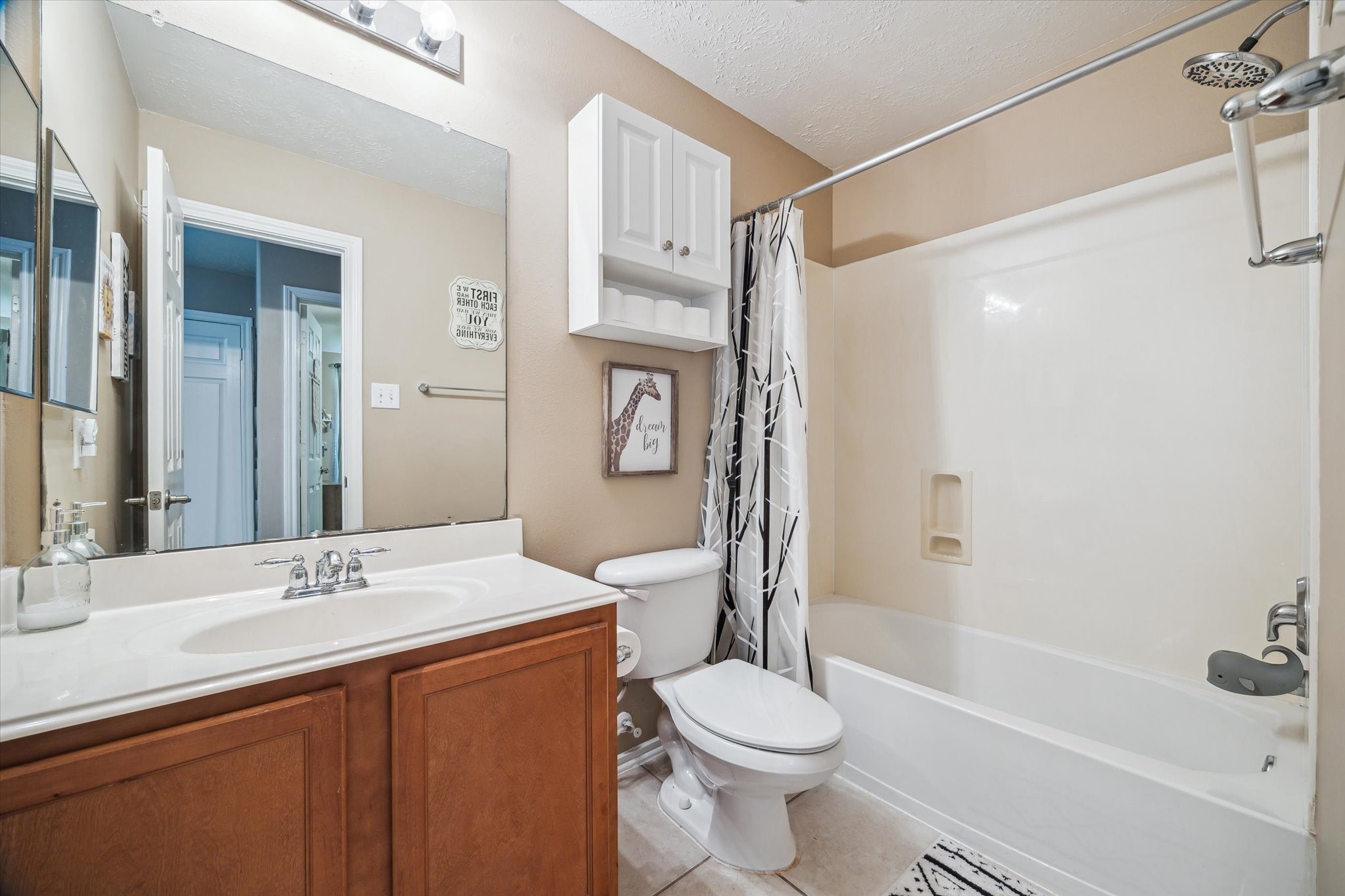 225 Drake Run Lane Dickinson, TX 77539 - Photo 18 of 22 a bathroom with a sink a toilet and shower