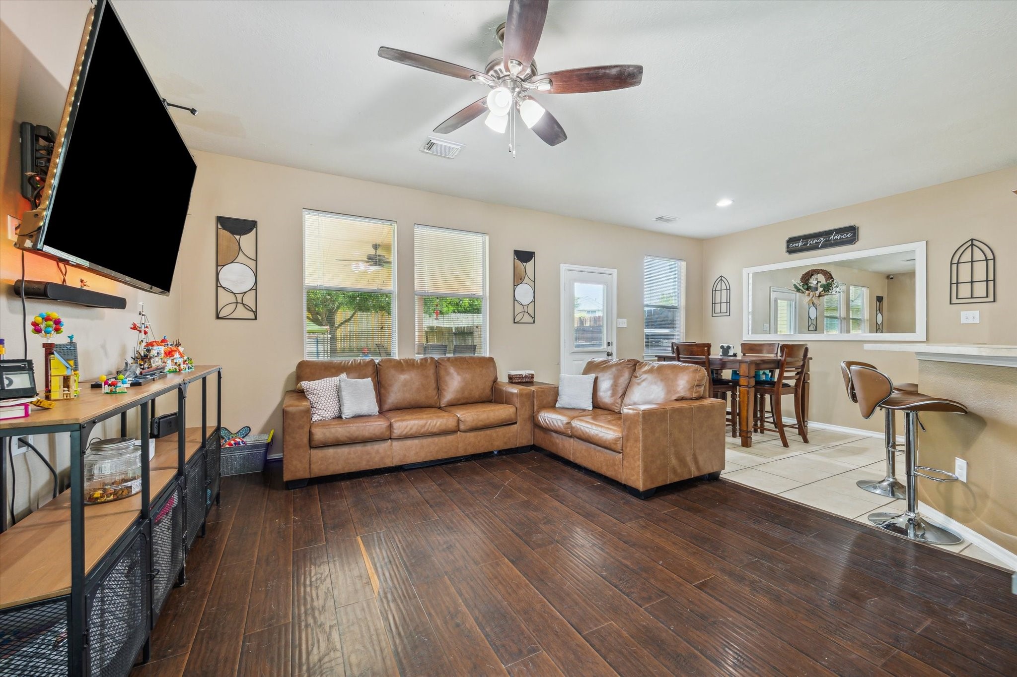 225 Drake Run Lane Dickinson, TX 77539 - Photo 4 of 22 a living room with furniture fireplace and a flat screen tv