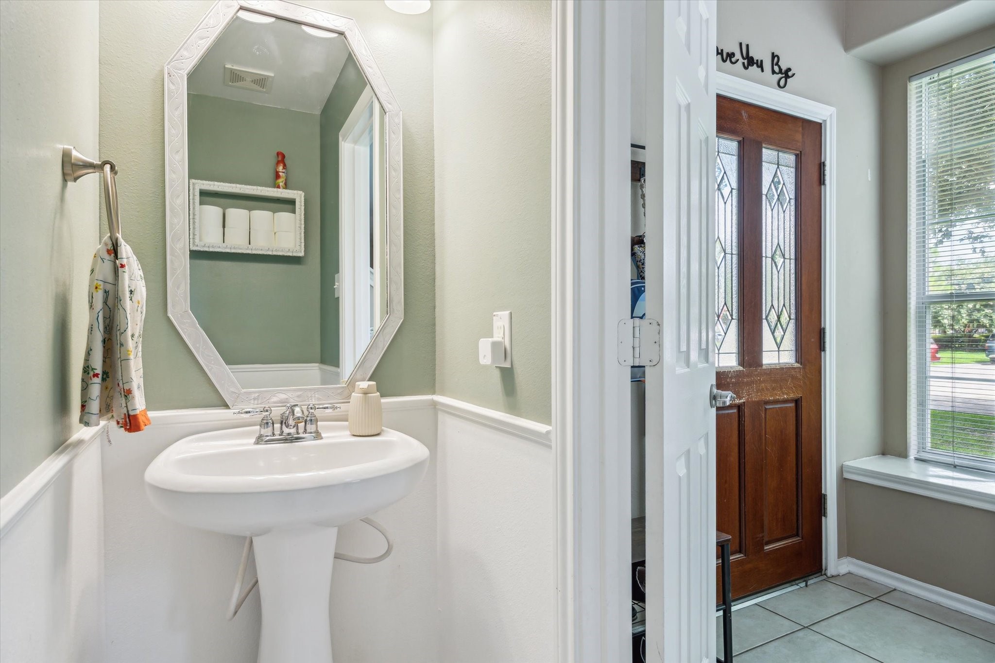 225 Drake Run Lane Dickinson, TX 77539 - Photo 9 of 22 a bathroom with a sink and a mirror