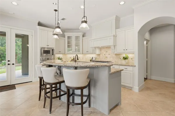 a view of a backyard with plants and patio