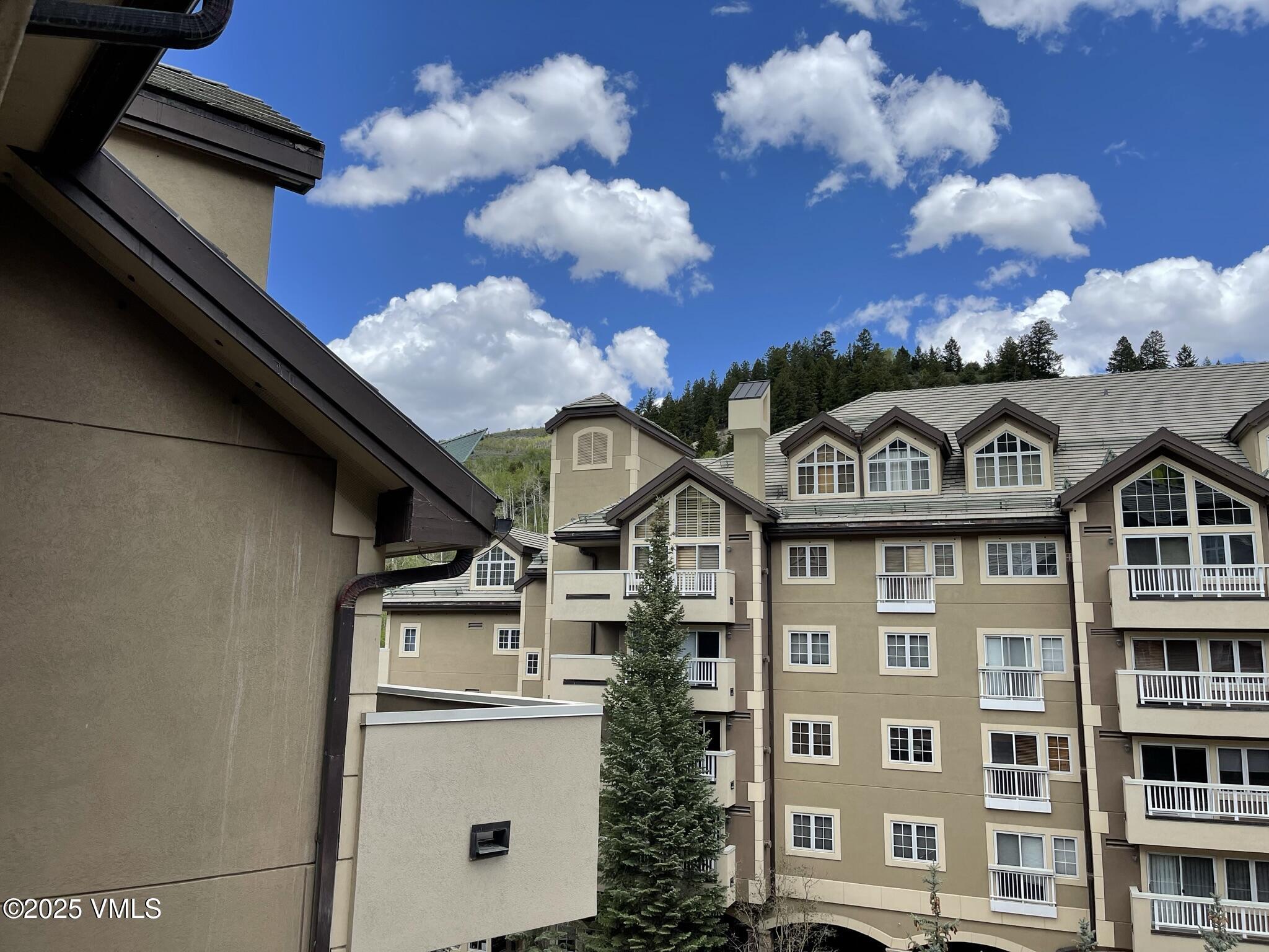 210 Offerson Road, Unit 308 WEEK 49 Beaver Creek, CO 81620 - Photo 4 of 31 a view of a white building with many windows