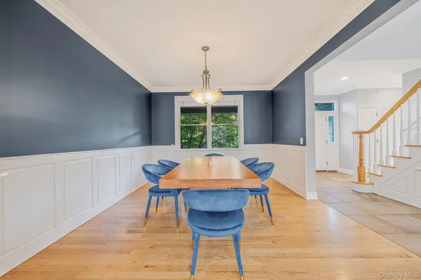 a dining room with a table and chairs