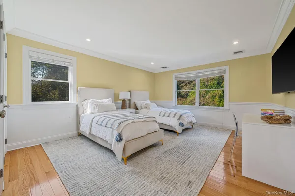 a bedroom with a bed and a couch