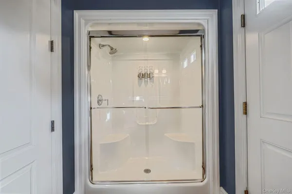 a bathroom with a glass door