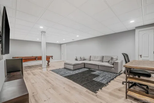 a living room with furniture and a rug