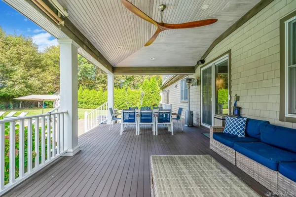 a outdoor living space with furniture and wooden floor