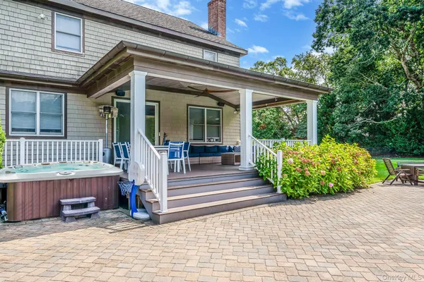 a view of a house with a small yard and plants