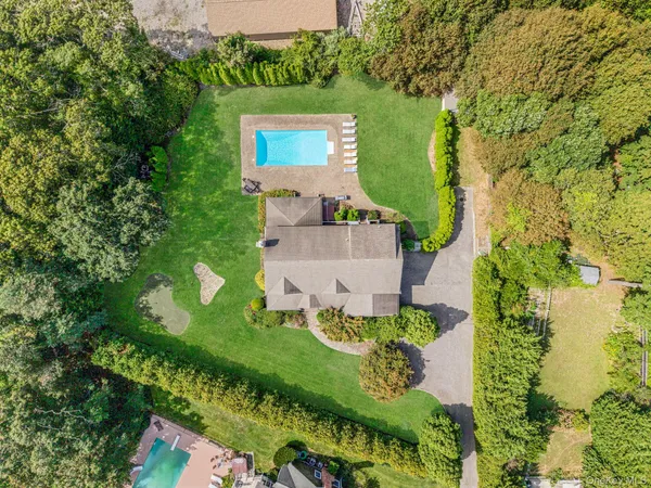 an aerial view of a house with a garden