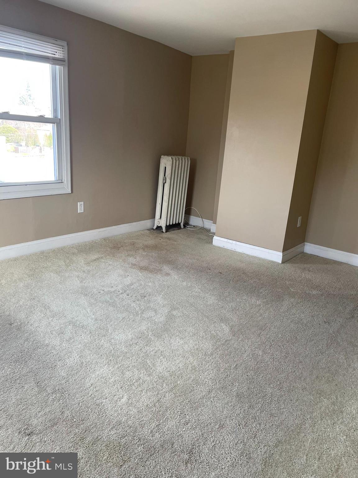221 Chester Avenue, Unit A Moorestown, NJ 08057 - Photo 4 of 13 an empty room with windows