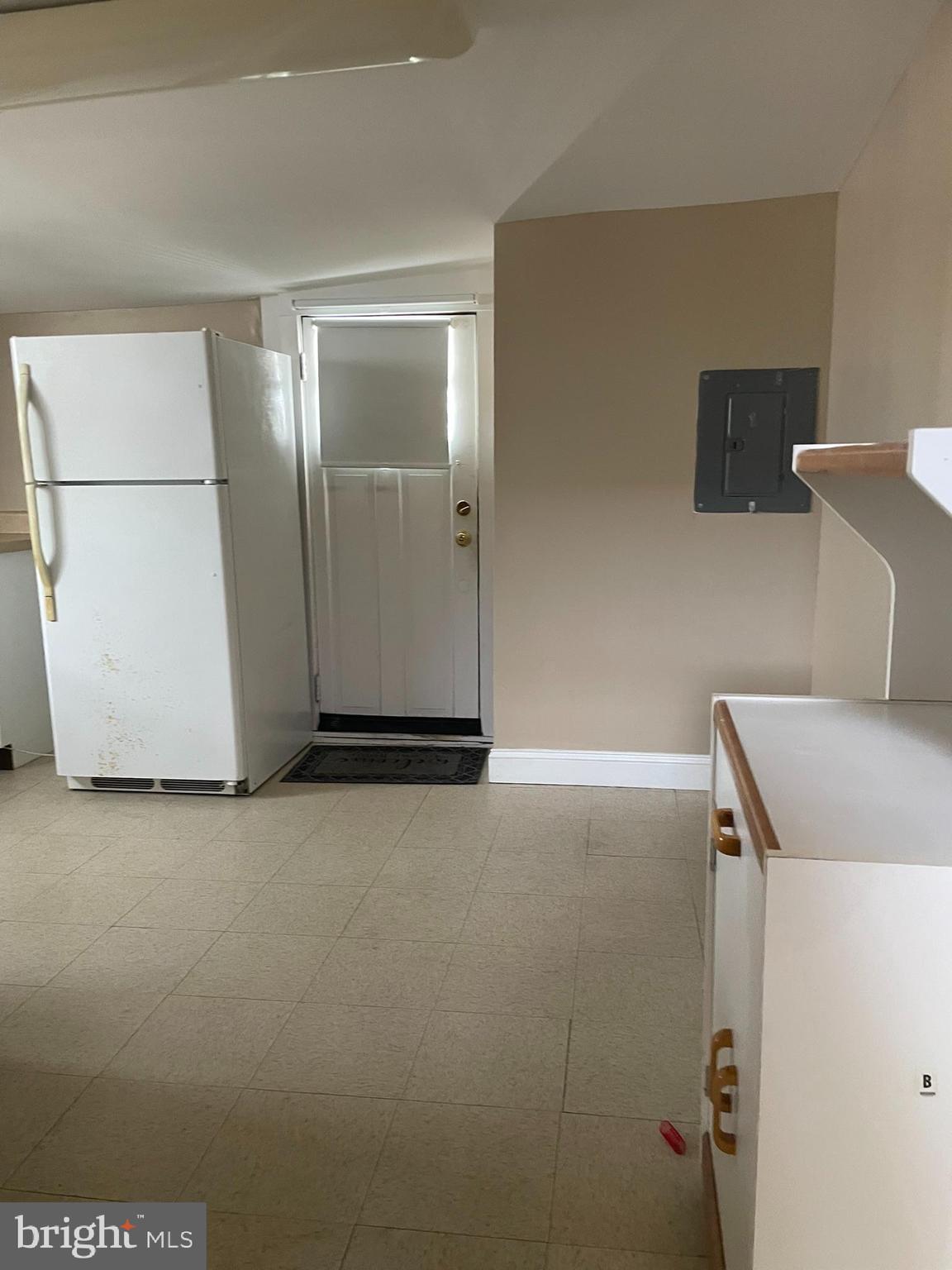 221 Chester Avenue, Unit A Moorestown, NJ 08057 - Photo 9 of 13 a view of a storage & utility room with a refrigerator