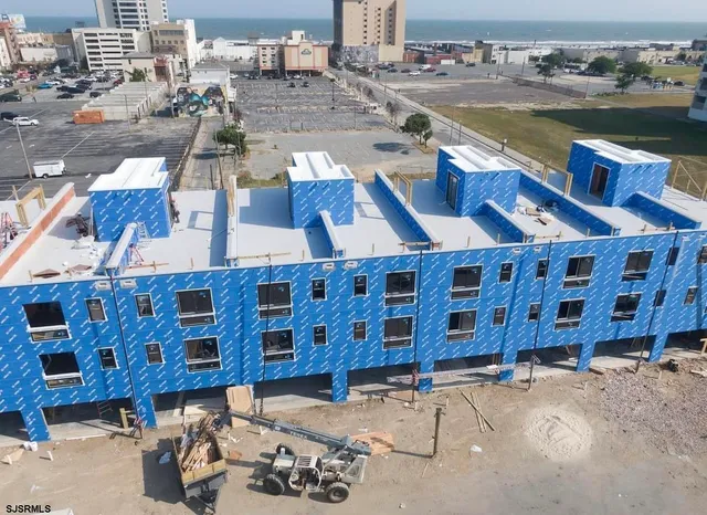 a front view of a building with outdoor seating