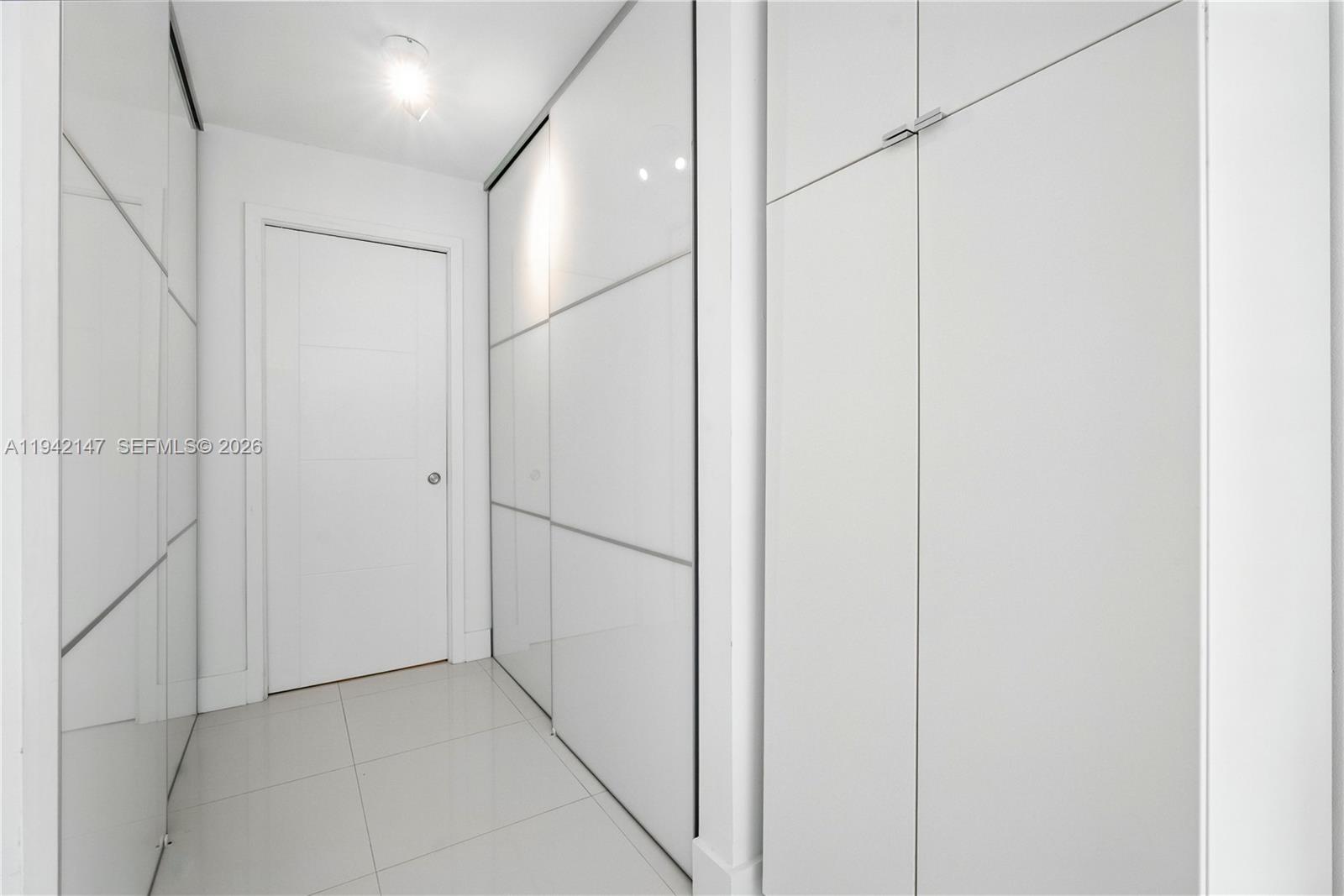 200 Southeast 15th Road, Unit 9I Miami, FL 33129 - Photo 13 of 24 a view of hallway with white walls