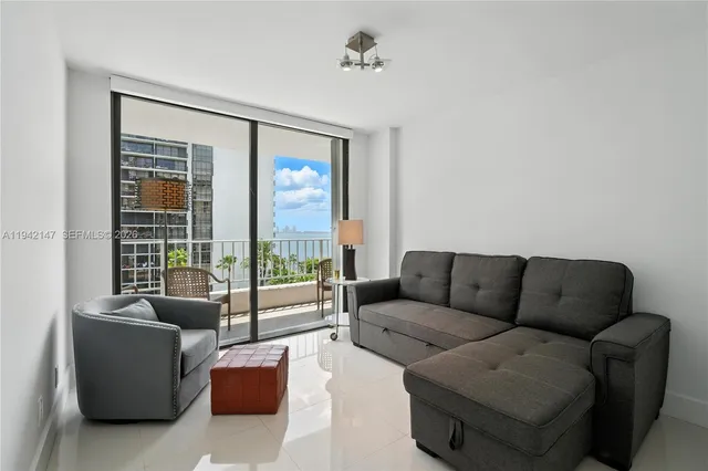 a living room with furniture and a window