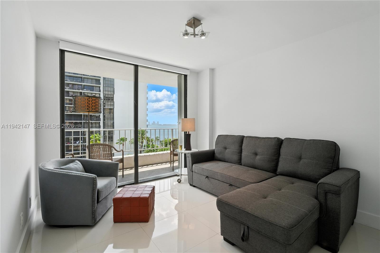 200 Southeast 15th Road, Unit 9I Miami, FL 33129 - Photo 14 of 24 a living room with furniture and a window