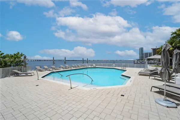swimming pool with chairs
