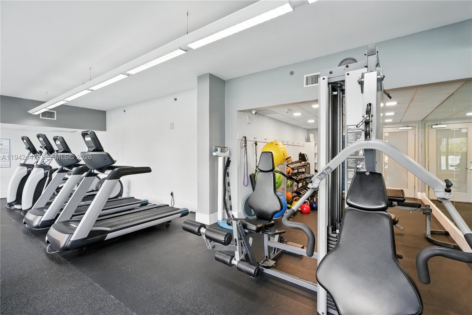 200 Southeast 15th Road, Unit 9I Miami, FL 33129 - Photo 22 of 24 a view of a room with gym equipment