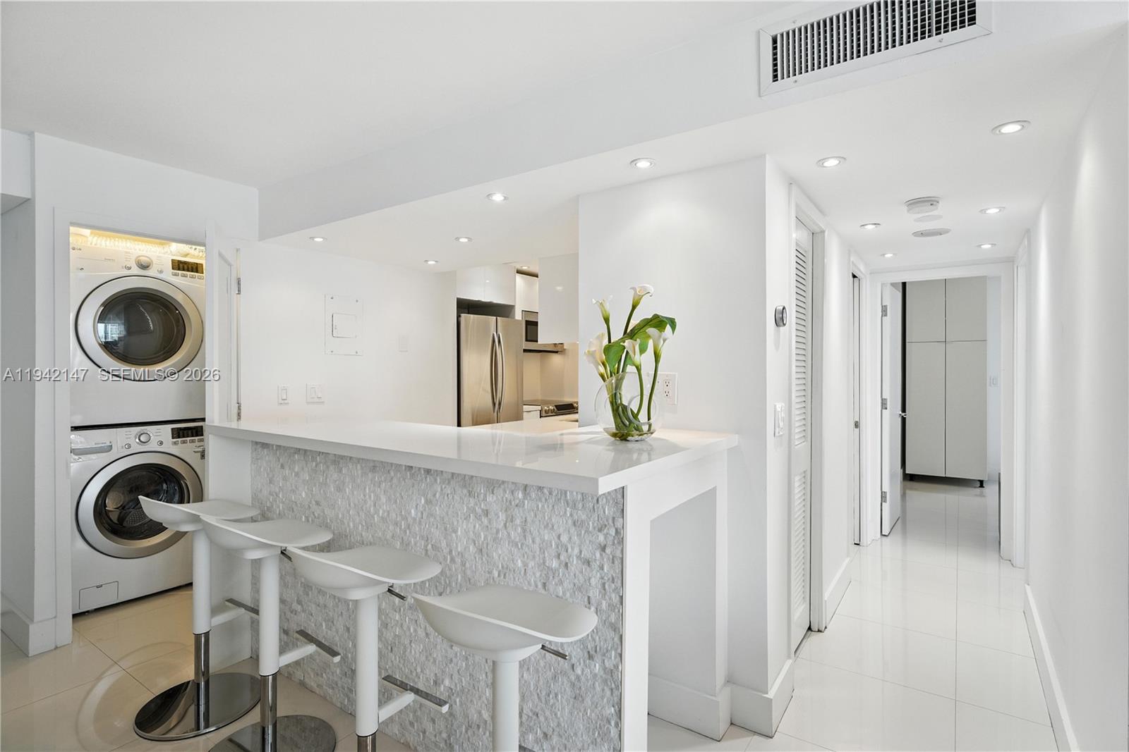 200 Southeast 15th Road, Unit 9I Miami, FL 33129 - Photo 6 of 24 a view of living room washer and dryer
