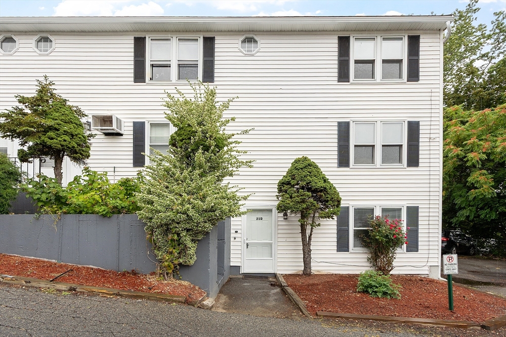 a house that has a tree in front of the house