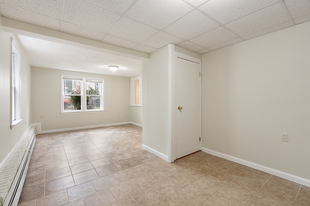 21 Crescent Street, Unit D Lawrence, MA 01841 - Photo 12 of 25 an empty room with windows