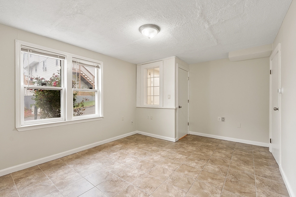 21 Crescent Street, Unit D Lawrence, MA 01841 - Photo 15 of 25 a view of an empty room with a window