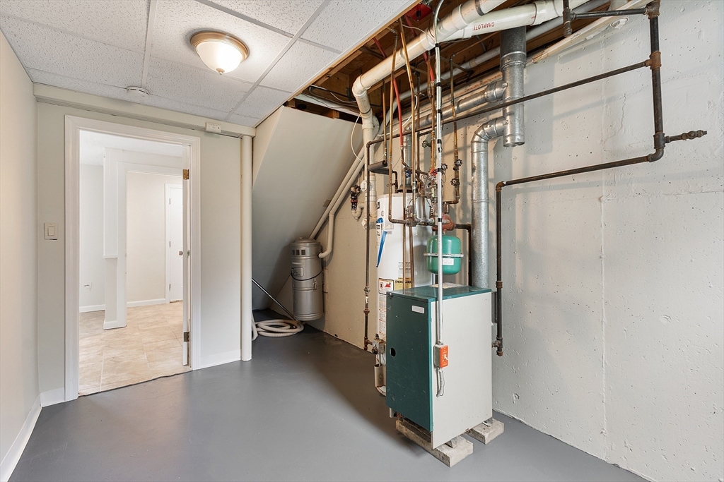 21 Crescent Street, Unit D Lawrence, MA 01841 - Photo 24 of 25 a view of a hallway with staircase and door