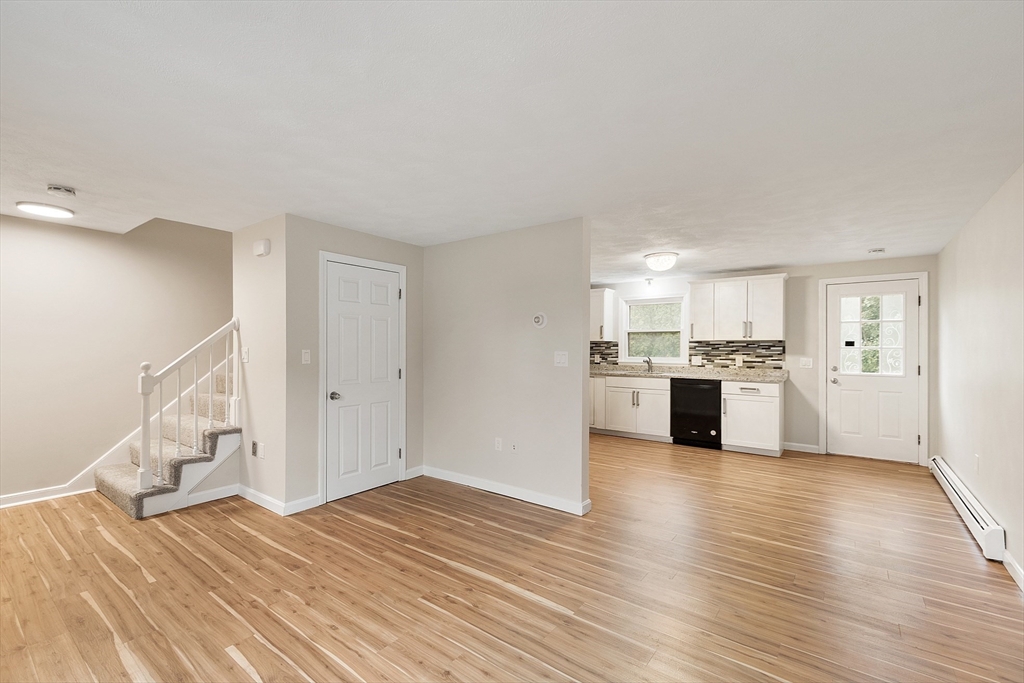 21 Crescent Street, Unit D Lawrence, MA 01841 - Photo 9 of 25 a view of a kitchen with wooden floor and a sink