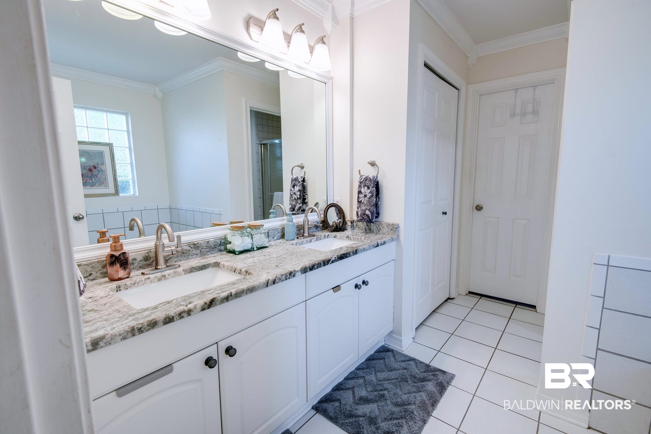 10093 Willis Road Foley, AL 36535 - Photo 10 of 33 Full bath with ornamental molding, double vanity, light tile patterned floors, and a shower stall