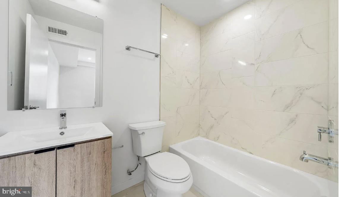 300 Budd Street, Unit B2 Philadelphia, PA 19104 - Photo 12 of 23 a bathroom with a sink toilet and shower