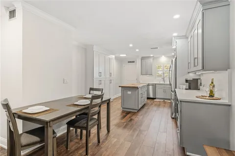 a kitchen with a sink stove and refrigerator