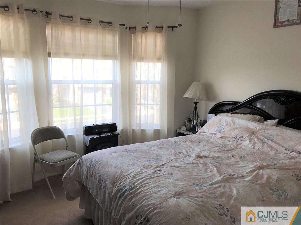 82 Orion Road, Unit 82 Piscataway, NJ 08854 - Photo 13 of 13 a bedroom with a bed and a window