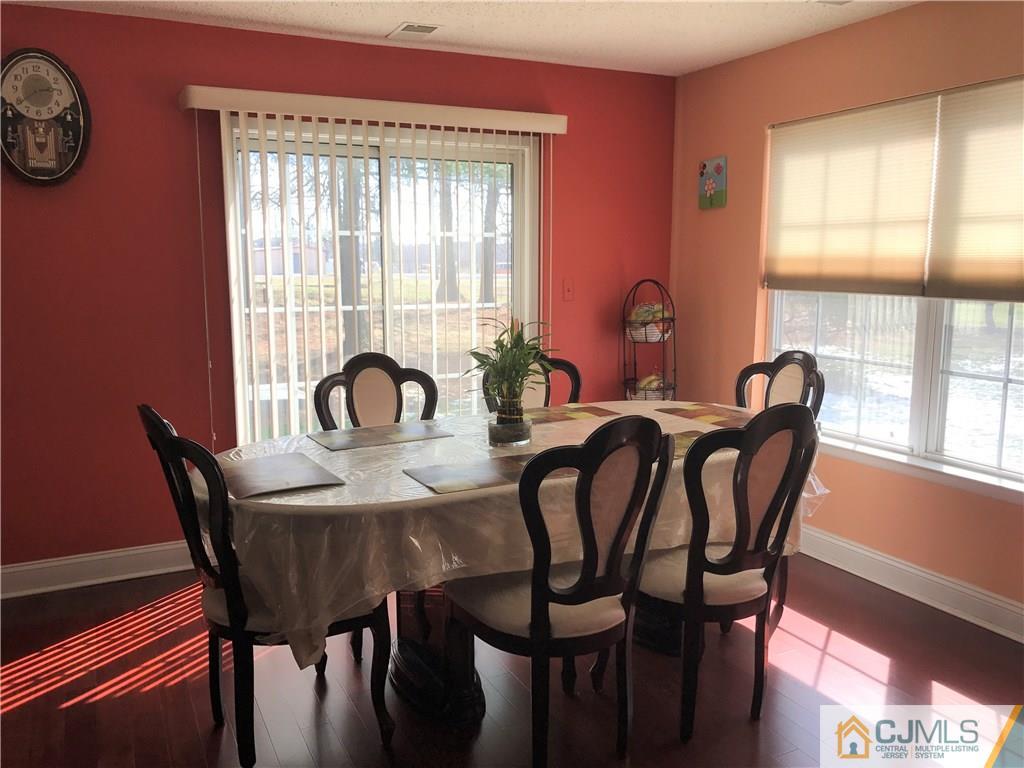 82 Orion Road, Unit 82 Piscataway, NJ 08854 - Photo 5 of 13 a view of a dining room with furniture and window