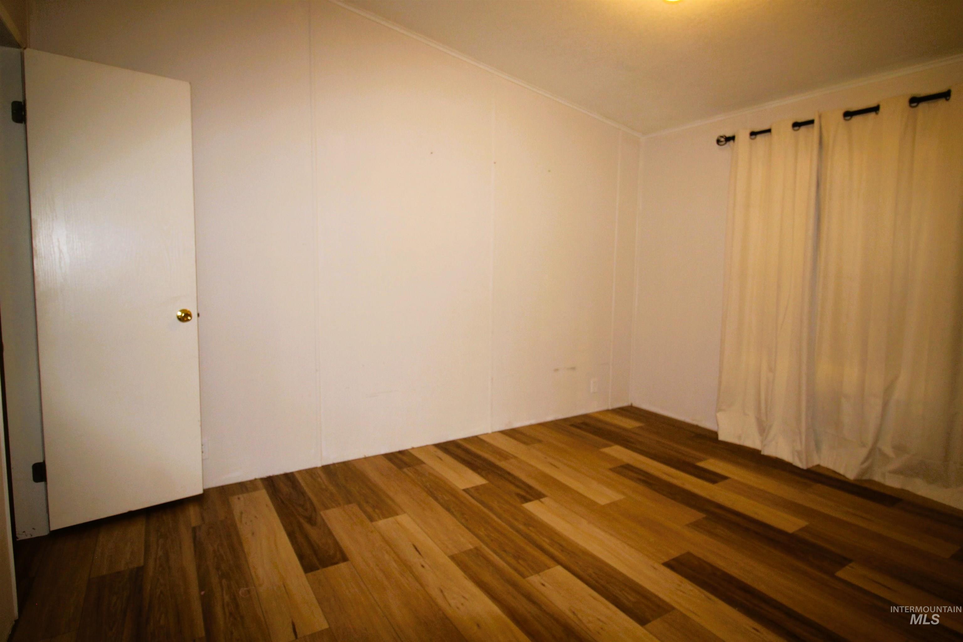 1550 Thousand Springs Road Weiser, ID 83672 - Photo 19 of 42 Unfurnished room with dark wood-style flooring