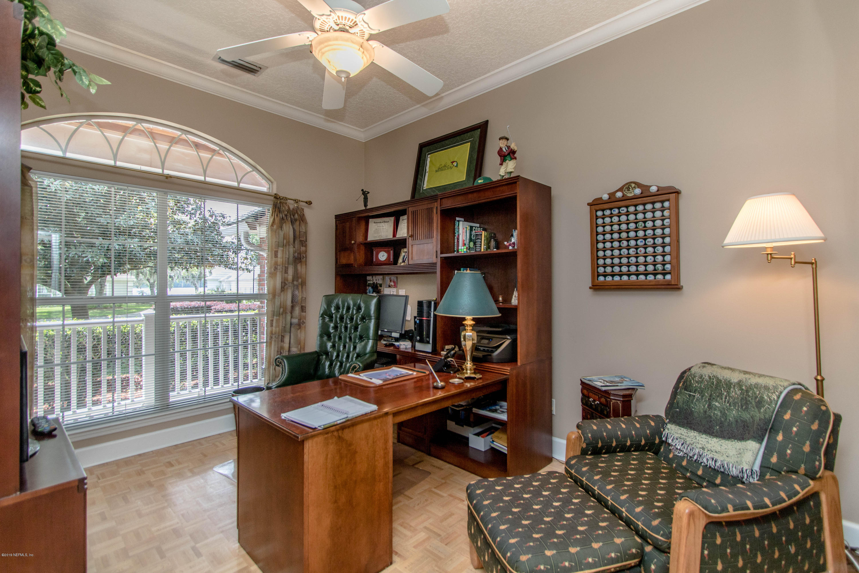 1944 Salt Myrtle Lane Fleming Island, FL 32003 - Photo 37 of 76 a living room with furniture a rug and a chandelier