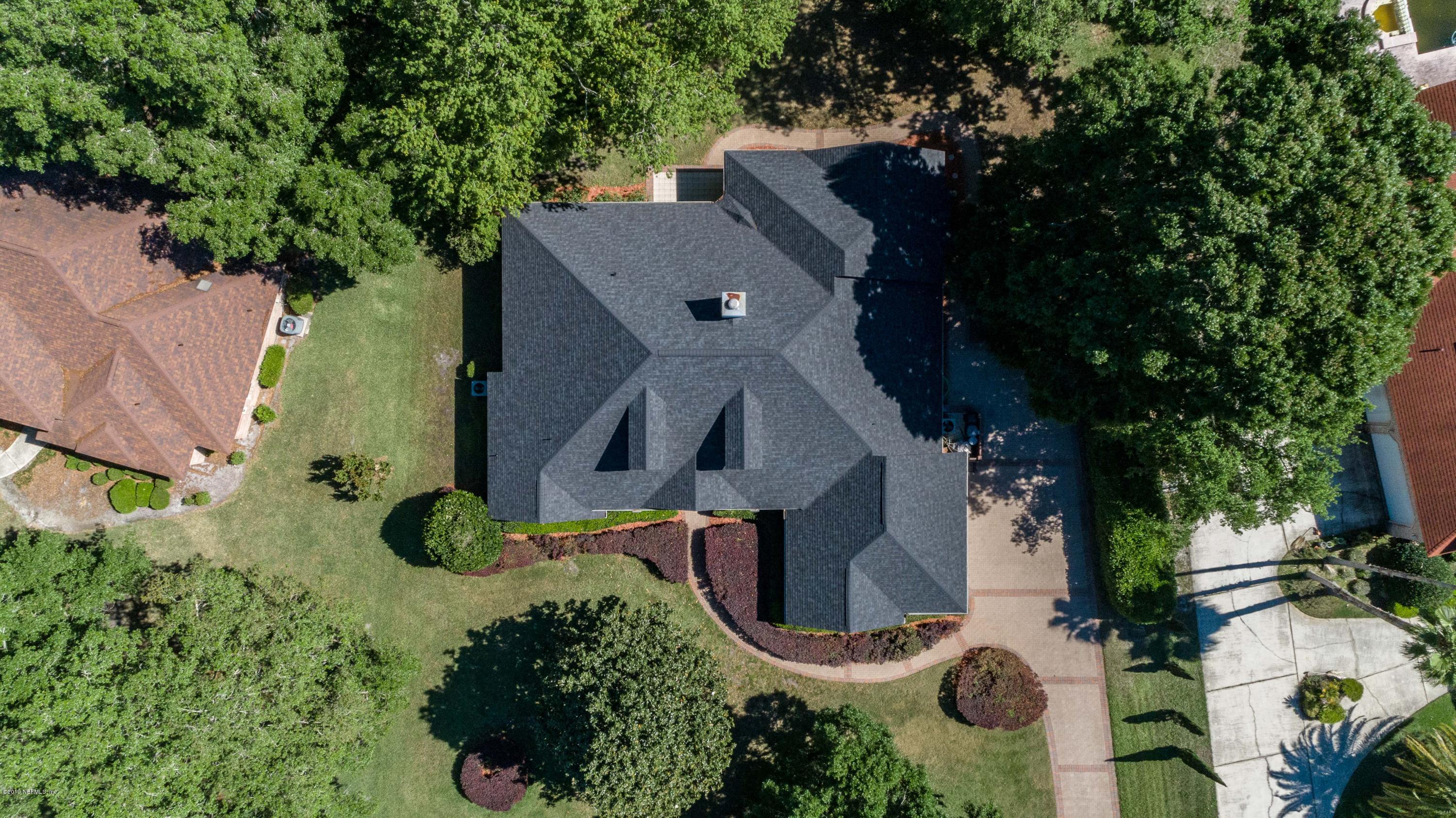 1944 Salt Myrtle Lane Fleming Island, FL 32003 - Photo 74 of 76 an aerial view of a house with a yard