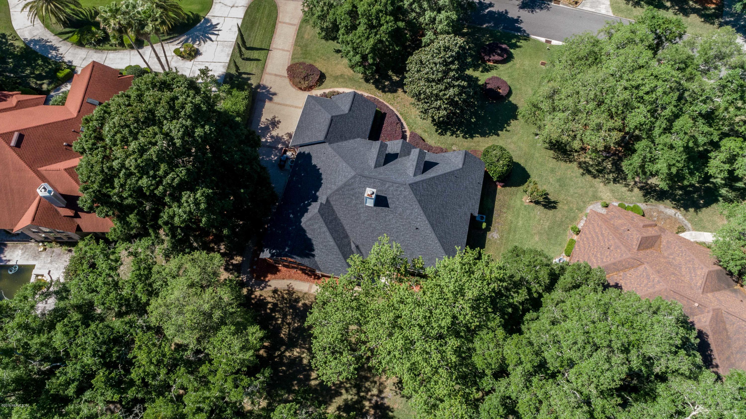1944 Salt Myrtle Lane Fleming Island, FL 32003 - Photo 75 of 76 an aerial view of a house with a yard and garden