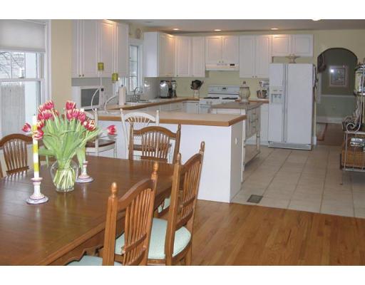 348 Weston Road Wellesley, MA 02482 - Photo 5 of 7 a kitchen with stainless steel appliances granite countertop a sink dishwasher and cabinets with wooden floor